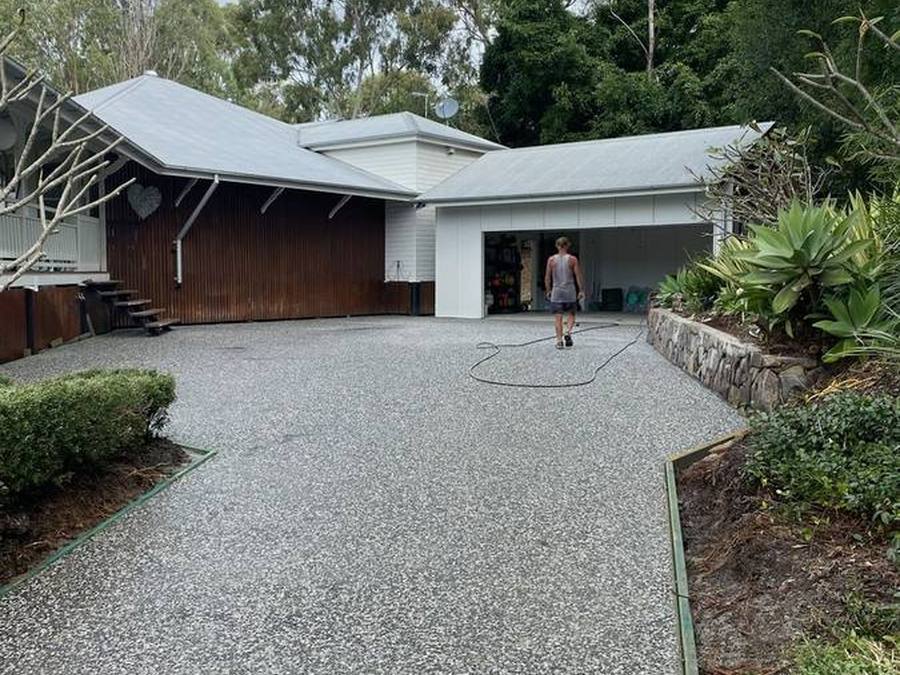 Exposed aggregate driveway at a resort-style home