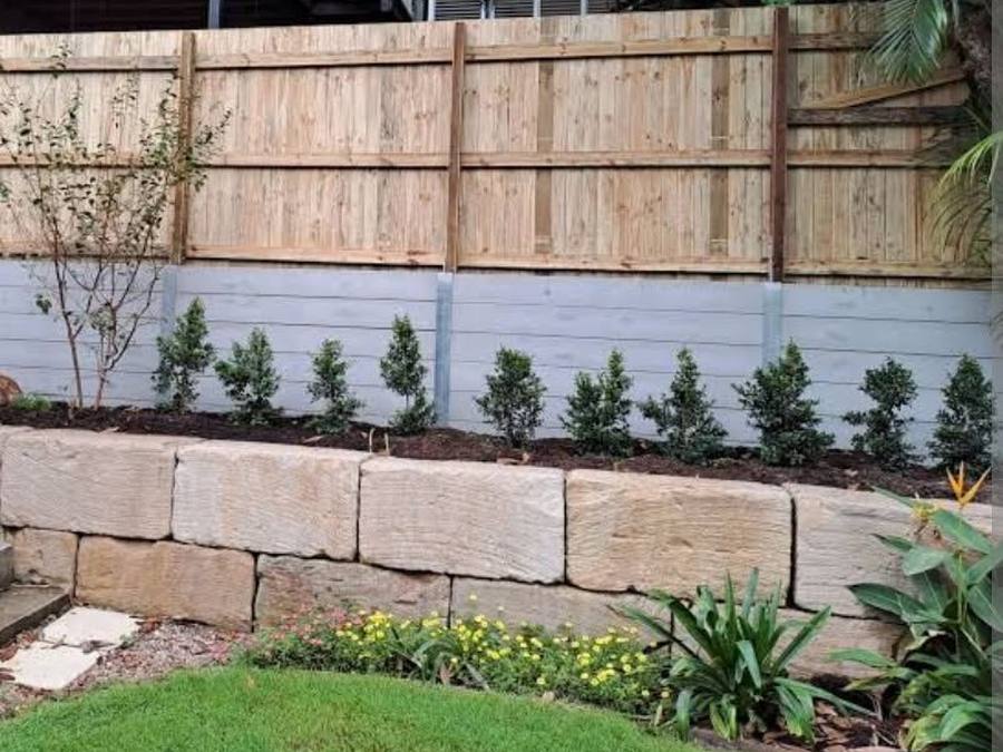 Concrete sleeper retaining wall with garden bed